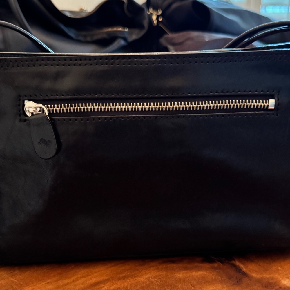 Elegant Monsac Leather Purse with Sleek Design and Silver Zipper